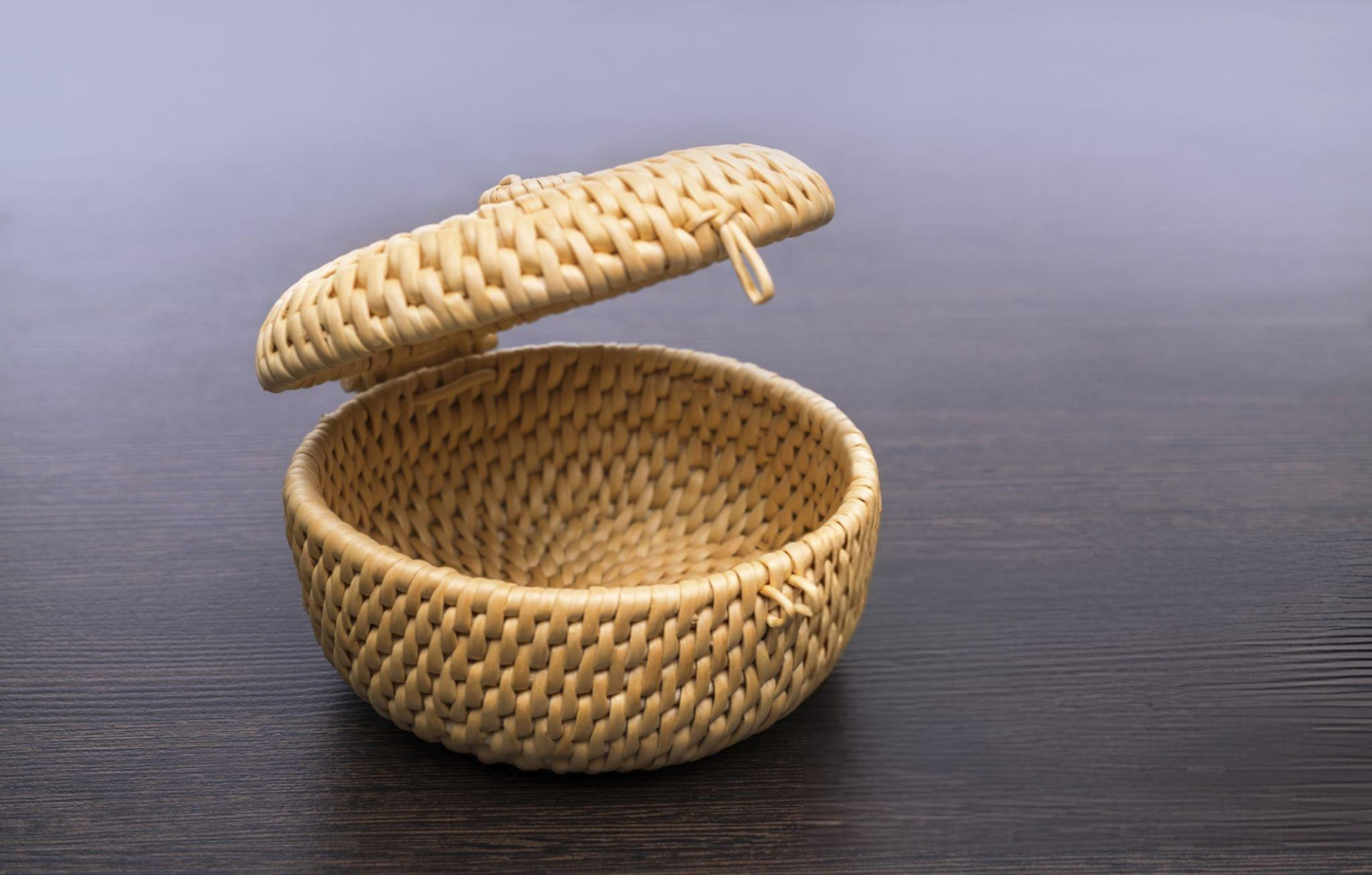 Round woven basket with lid, natural and rustic for compact, stylish storage.